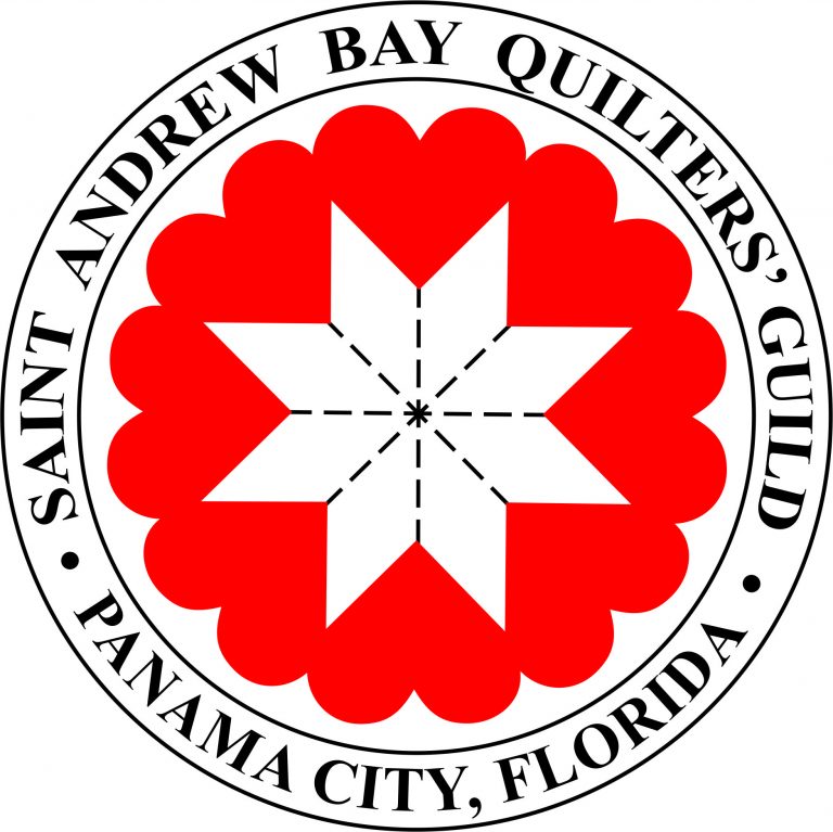circular badge style logo with dark text encircling a red quilt blocks and white stitched star